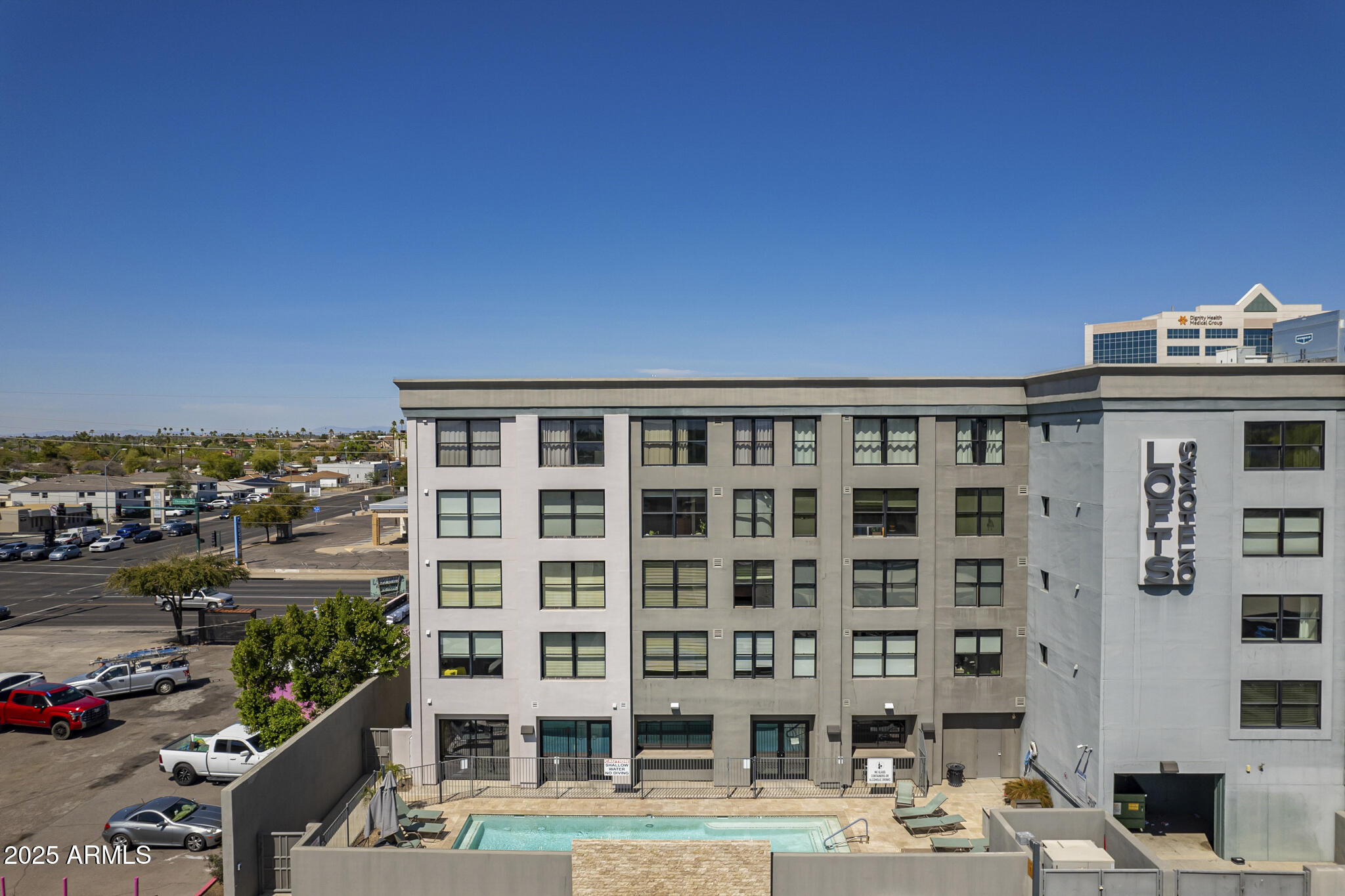 535 West Thomas Road, Unit 410 Phoenix, AZ 85013 - Photo 19 of 33 a front view of a building with glass windows and plants