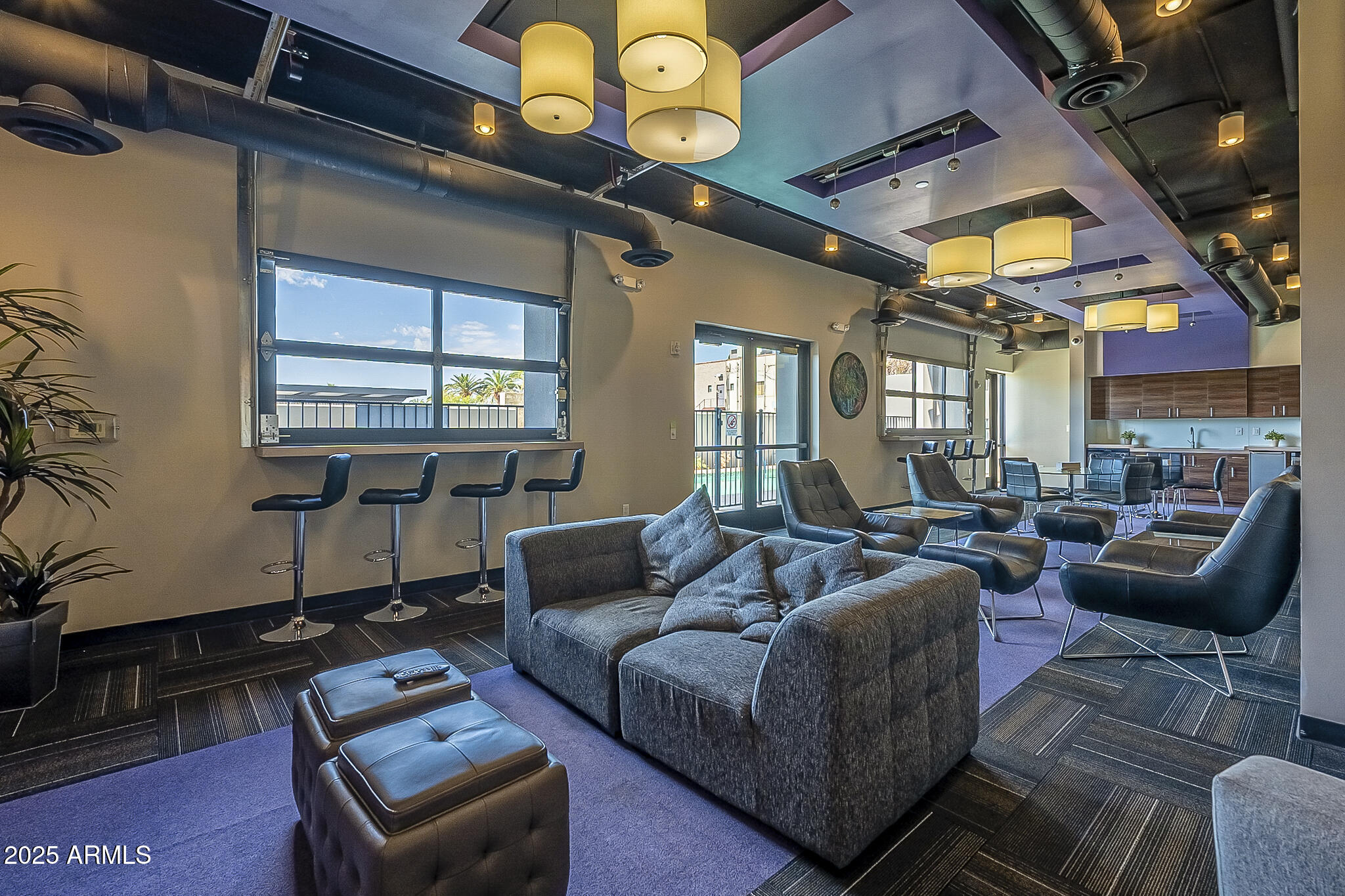 535 West Thomas Road, Unit 410 Phoenix, AZ 85013 - Photo 31 of 33 a living room with furniture a chandelier and a piano