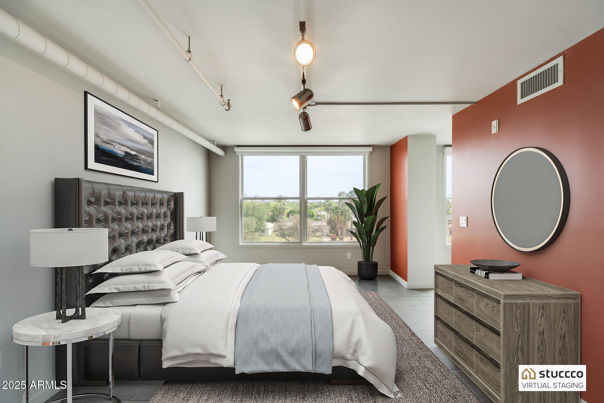 535 West Thomas Road, Unit 410 Phoenix, AZ 85013 - Photo 4 of 33 a bedroom with a bed a mirror and a window