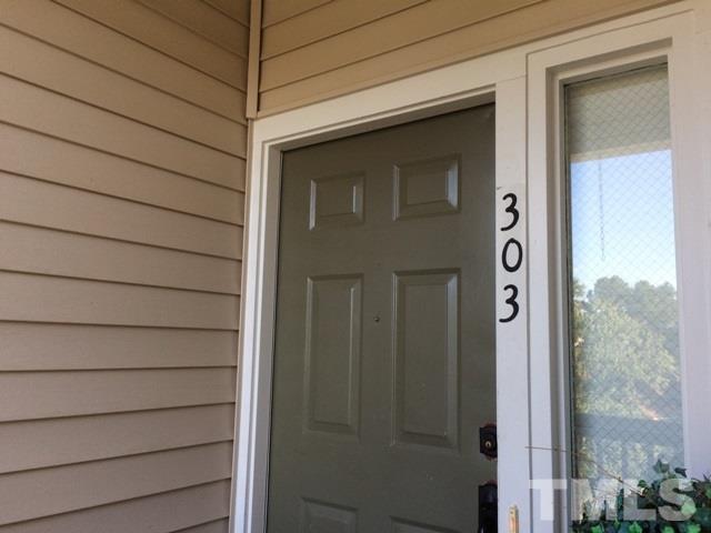 6000 Winterpointe Lane, Unit 303 Raleigh, NC 27606 - Photo 3 of 15 a view of a door and a window of a house