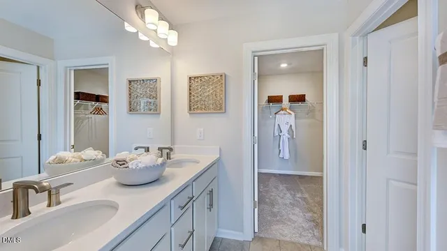 a bathroom with a shower and a sink
