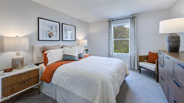 a bedroom with bed and a window