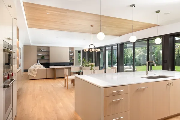 a kitchen with sink and cabinets