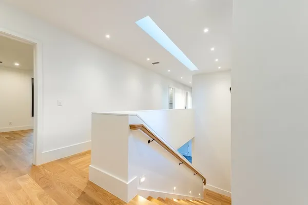 a view of a hallway with windows