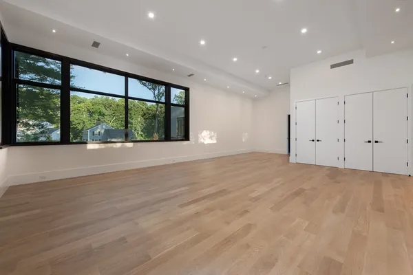 a view of an empty room with a floor to ceiling window