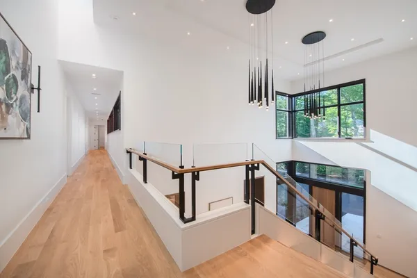 a view of an entryway with wooden floor
