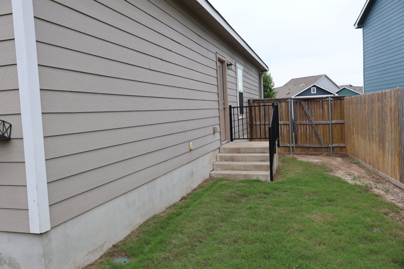 117 Galaxy Way Jarrell, TX 76537 - Photo 17 of 17 Exterior rear entrance with concrete steps