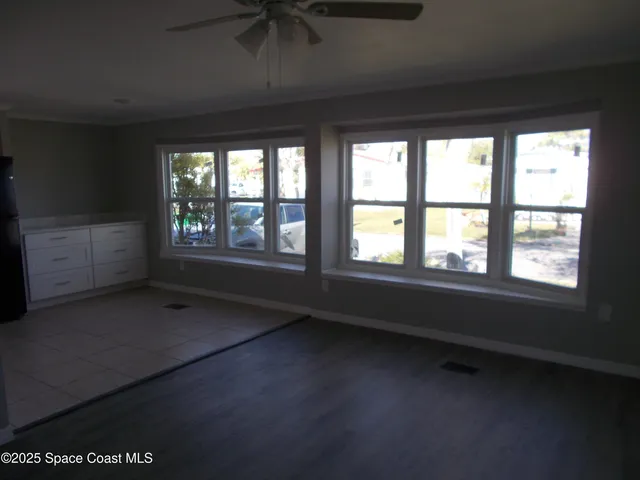 a view of an empty room with a window
