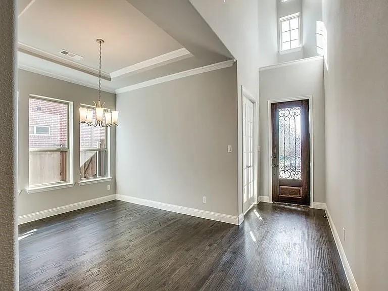 1322 Rolling Thunder Road Frisco, TX 75036 - Photo 2 of 20 an empty room with wooden floor and windows