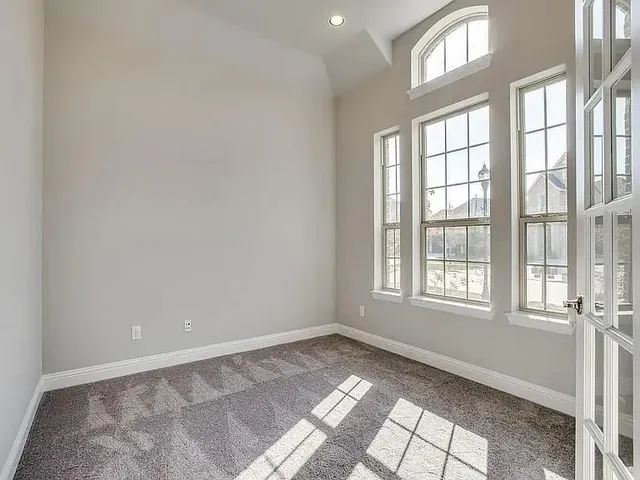 a view of an empty room and a window