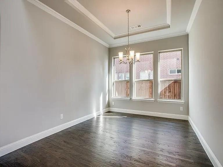 1322 Rolling Thunder Road Frisco, TX 75036 - Photo 4 of 20 an empty room with wooden floor and door