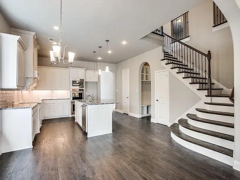 1322 Rolling Thunder Road Frisco, TX 75036 - Photo 7 of 20 a view of kitchen with wooden floor and electronic appliances