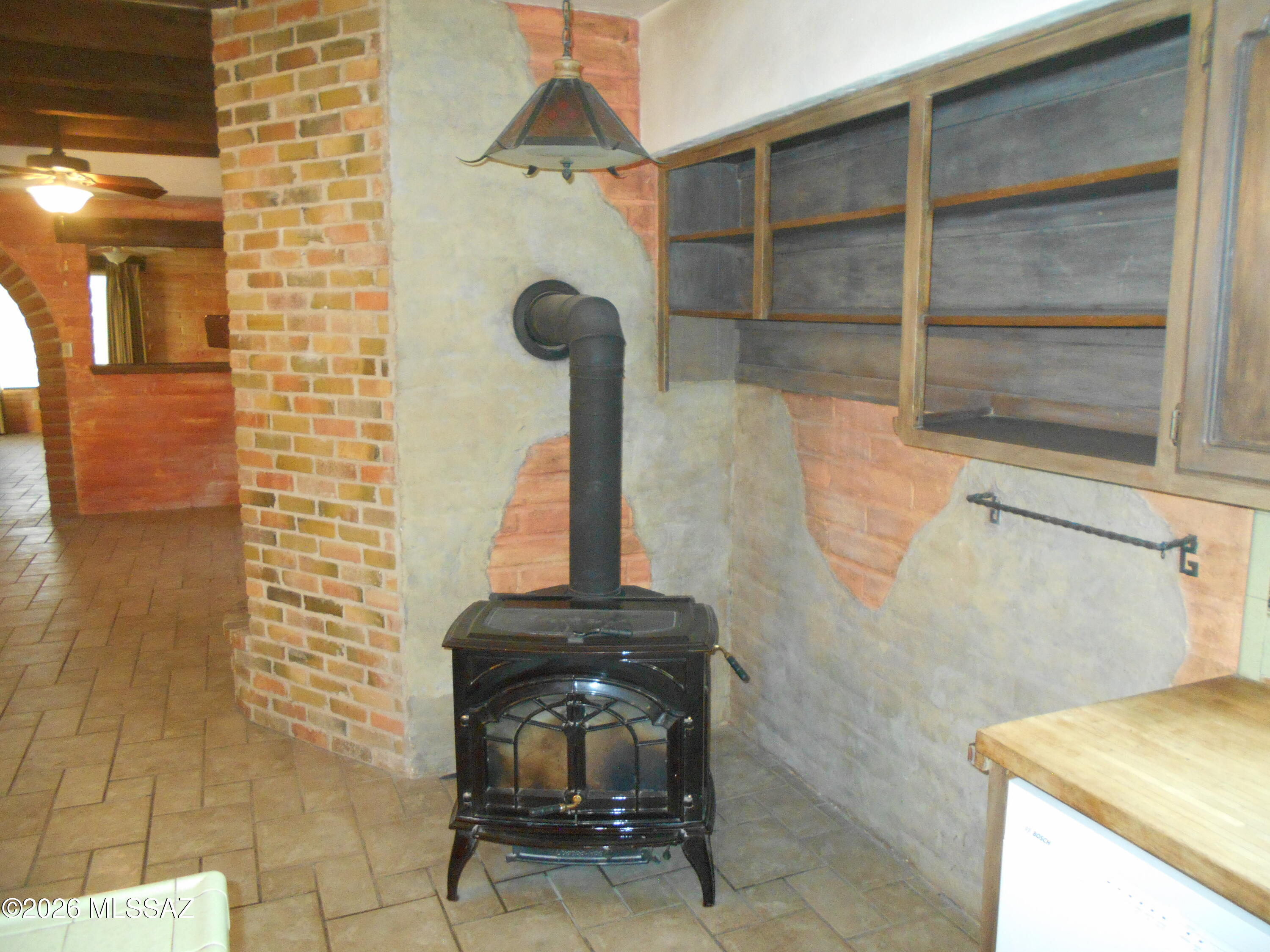 2223 North Ocotillo Road Benson, AZ 85602 - Photo 15 of 50 Wood stove for heat and cooking in the kitchen