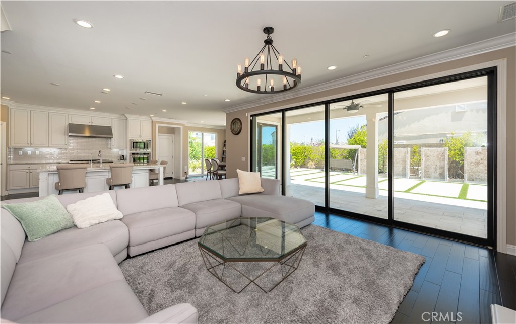 102 Diamondback Irvine, CA 92618 - Photo 14 of 47 a living room with furniture a table and a large window