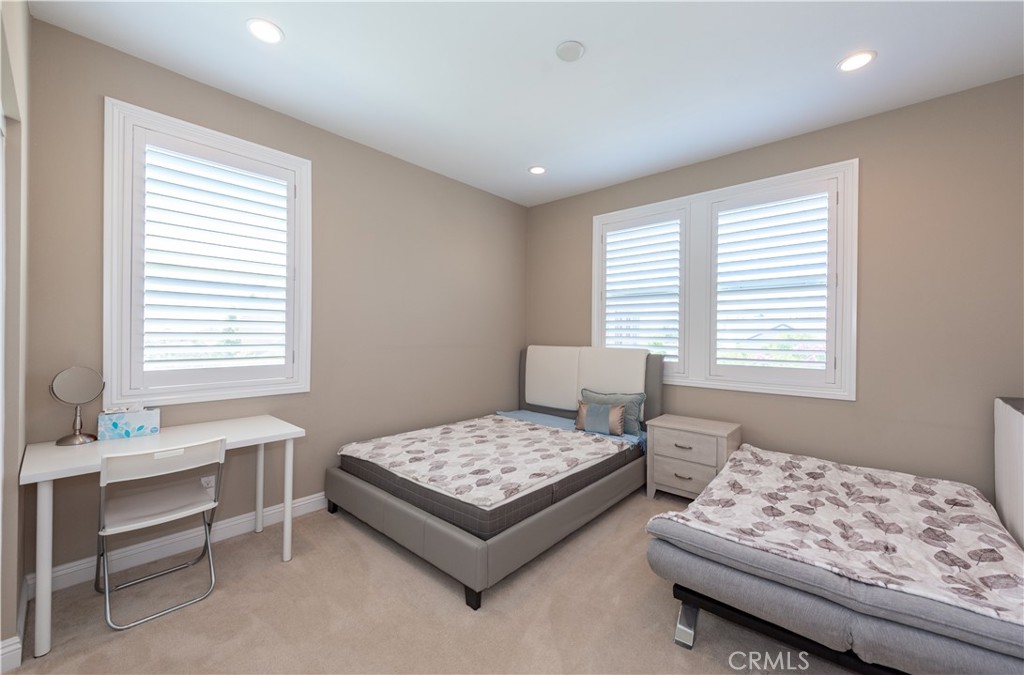 102 Diamondback Irvine, CA 92618 - Photo 20 of 47 a bedroom with a bed and a window