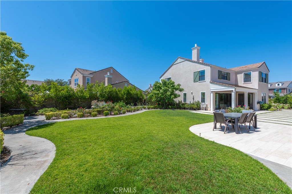 102 Diamondback Irvine, CA 92618 - Photo 2 of 47 a front view of a house with garden
