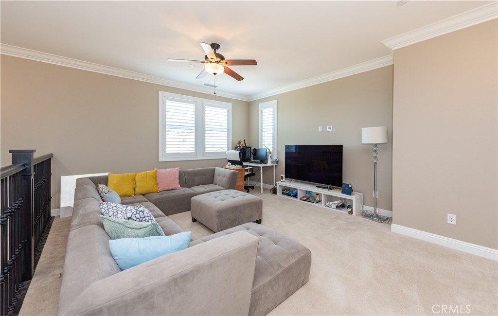 102 Diamondback Irvine, CA 92618 - Photo 24 of 47 a living room with furniture and a flat screen tv