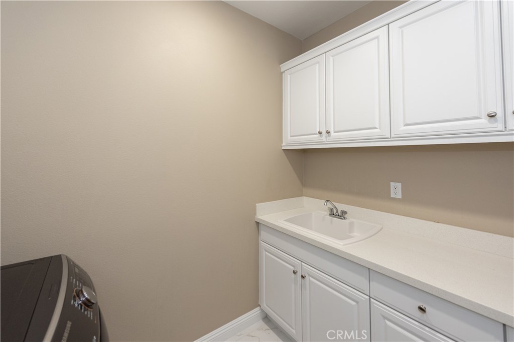 102 Diamondback Irvine, CA 92618 - Photo 29 of 47 a bathroom with a sink and cabinets