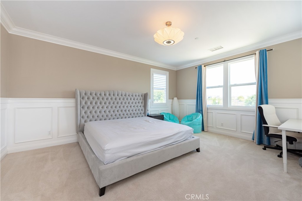 102 Diamondback Irvine, CA 92618 - Photo 30 of 47 a bedroom with a bed and window