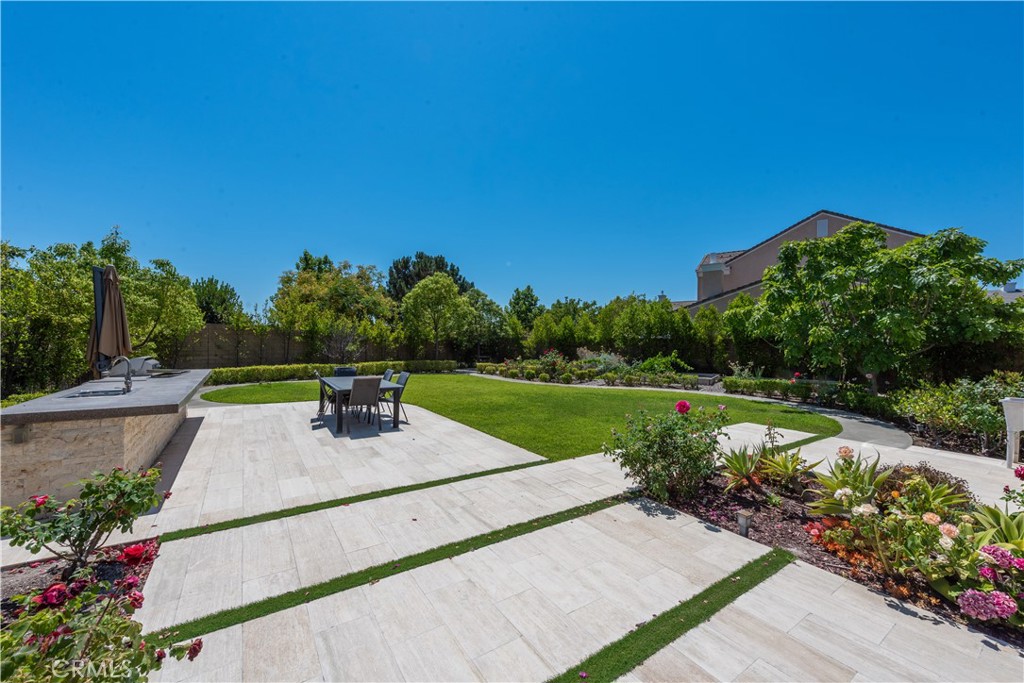 102 Diamondback Irvine, CA 92618 - Photo 44 of 47 a view of a garden and basketball court