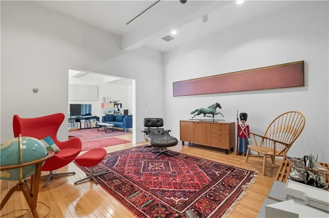 a living room with furniture rug and window