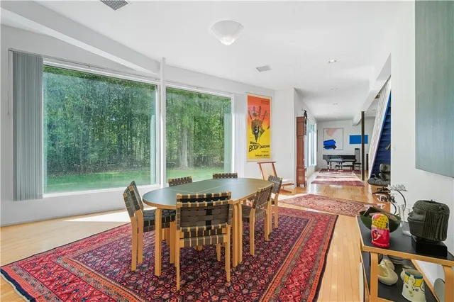 a view of a dining room with furniture window and outside view