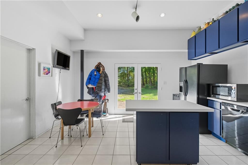 3191 Mercer Road New Castle, PA 16105 - Photo 21 of 50 a view of a kitchen with a dining table and chairs