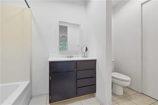 a bathroom with a sink toilet and vanity