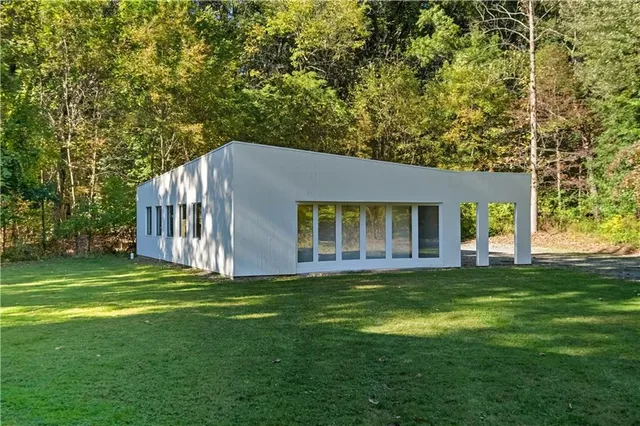 a house with a tree in front of it