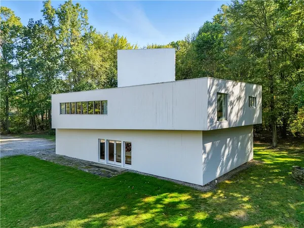 a view of house with backyard