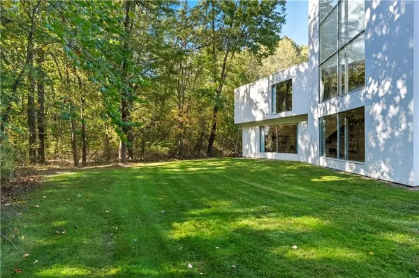 a view of a building with a yard