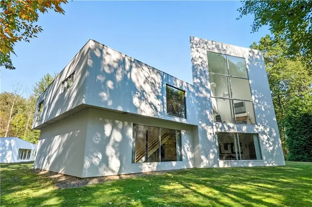 an aerial view of a house with a yard