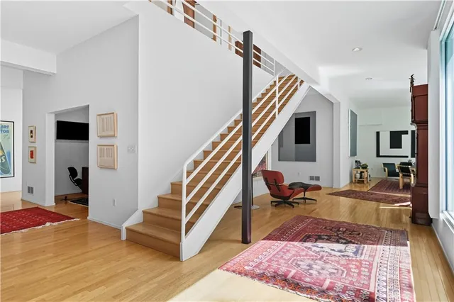 a living room with furniture and a rug