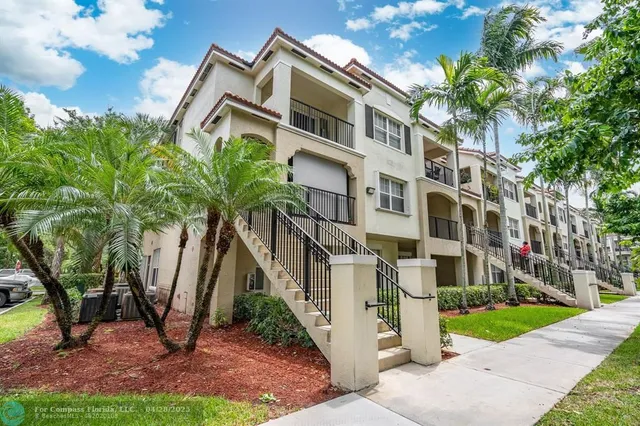 a view of a building with a yard