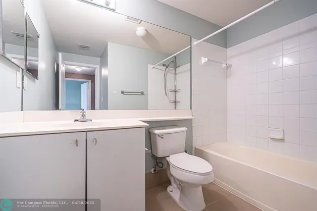 a bathroom with a sink a toilet and a bathtub