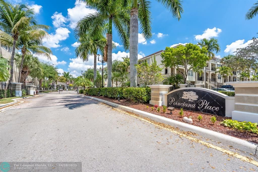 5840 West Sample Road, Unit 301 Coral Springs, FL 33067 - Photo 19 of 19 a front view of a house with garden and parking
