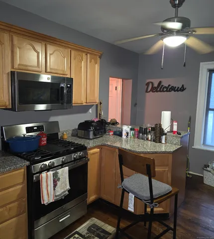 a kitchen with a stove and a microwave