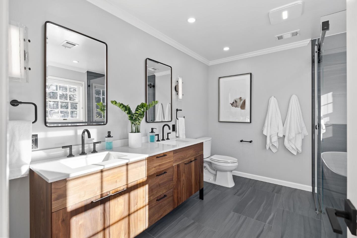 1652 Ralston Avenue Belmont, CA 94002 - Photo 16 of 45 a bathroom with a double vanity sink toilet mirror and shower