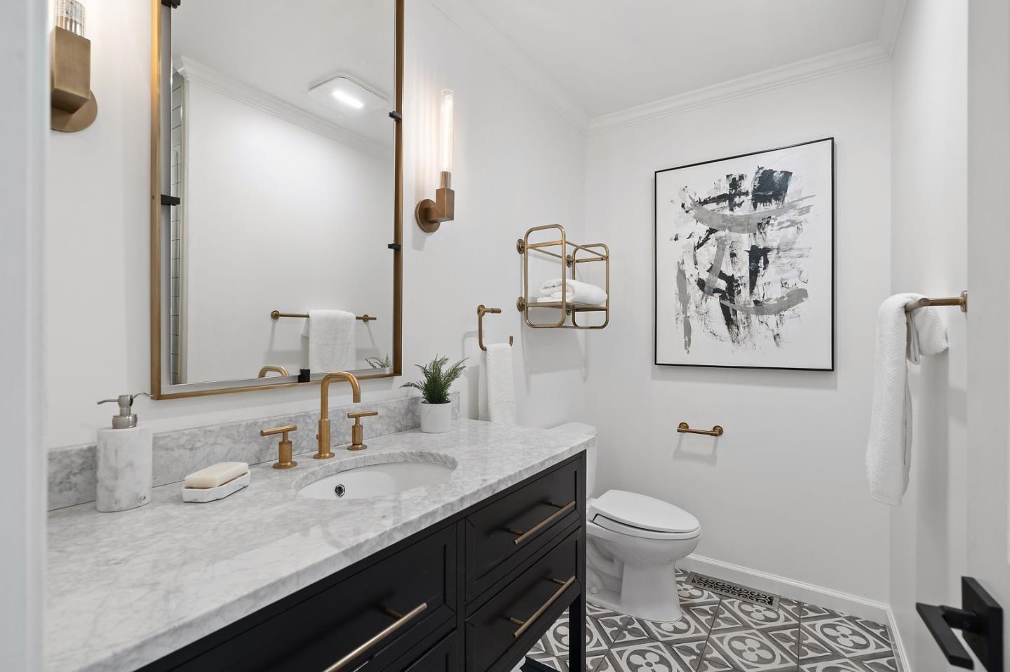 1652 Ralston Avenue Belmont, CA 94002 - Photo 23 of 45 a bathroom with a granite countertop sink a toilet and a mirror