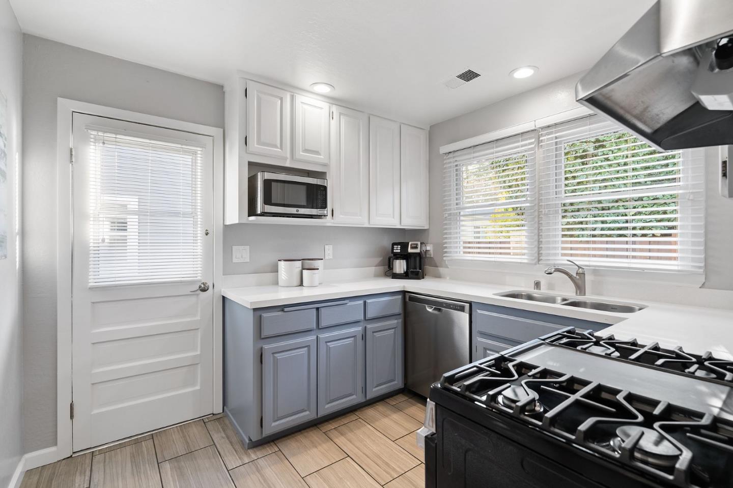 1652 Ralston Avenue Belmont, CA 94002 - Photo 33 of 45 a kitchen with a stove a sink and a window
