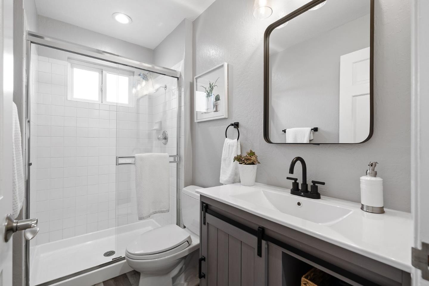 1652 Ralston Avenue Belmont, CA 94002 - Photo 40 of 45 a bathroom with a sink a toilet and shower
