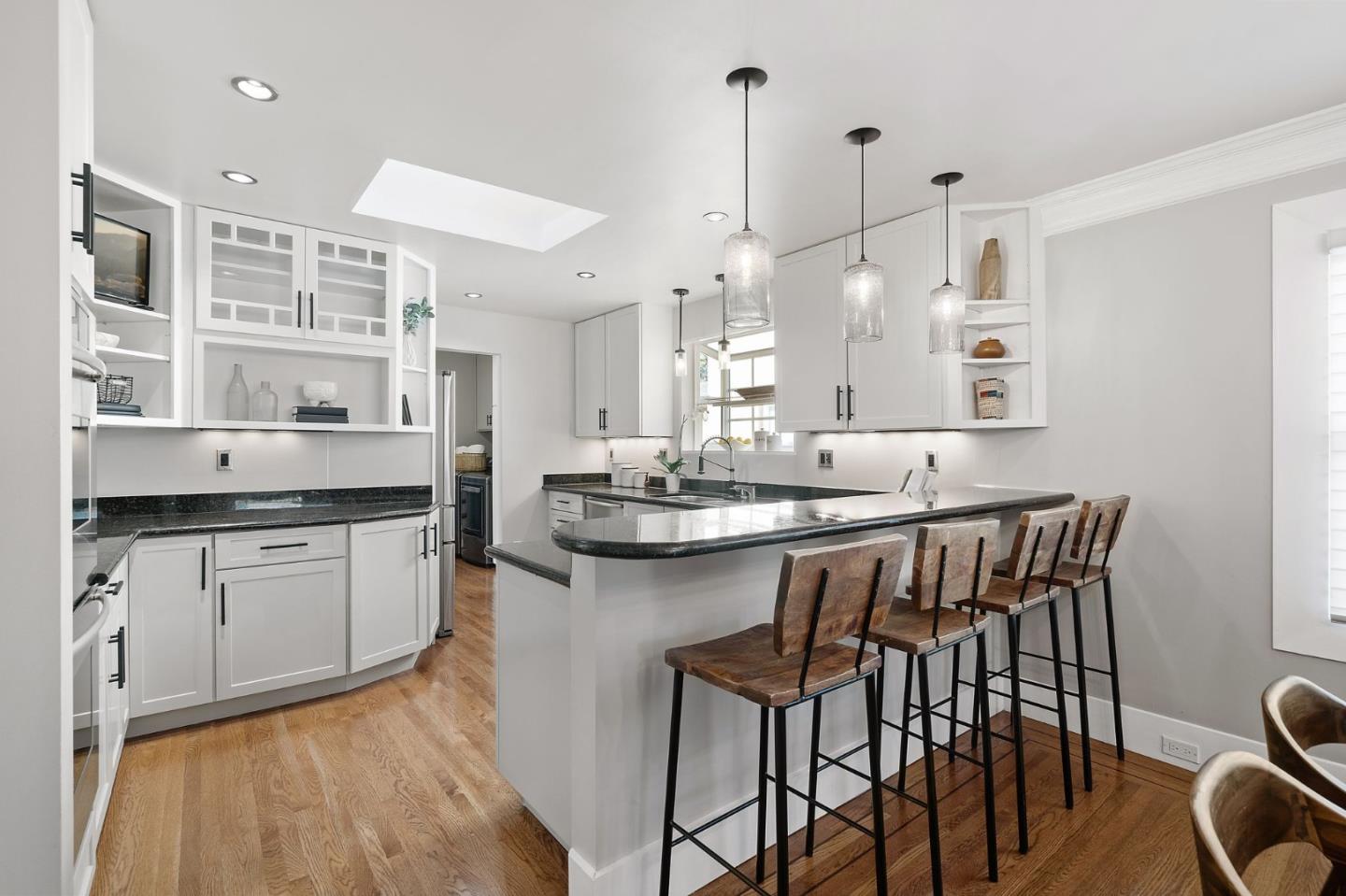 1652 Ralston Avenue Belmont, CA 94002 - Photo 9 of 45 a kitchen with a sink and chairs