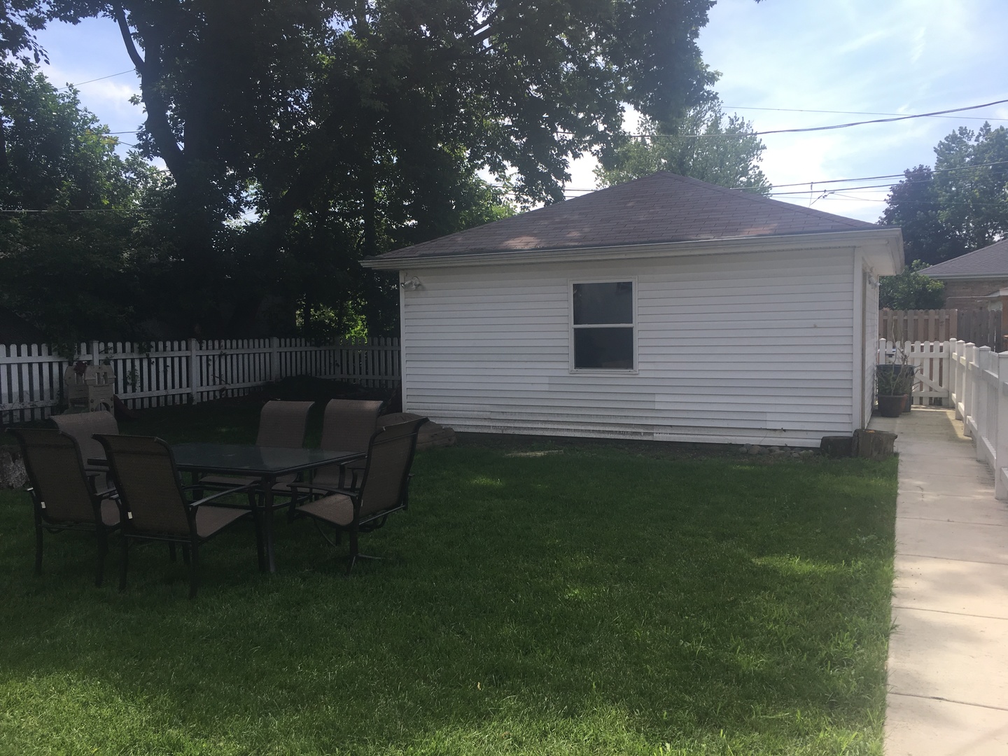 2422 Forest Avenue North Riverside, IL 60546 - Photo 4 of 19 a backyard of a house with table and chairs