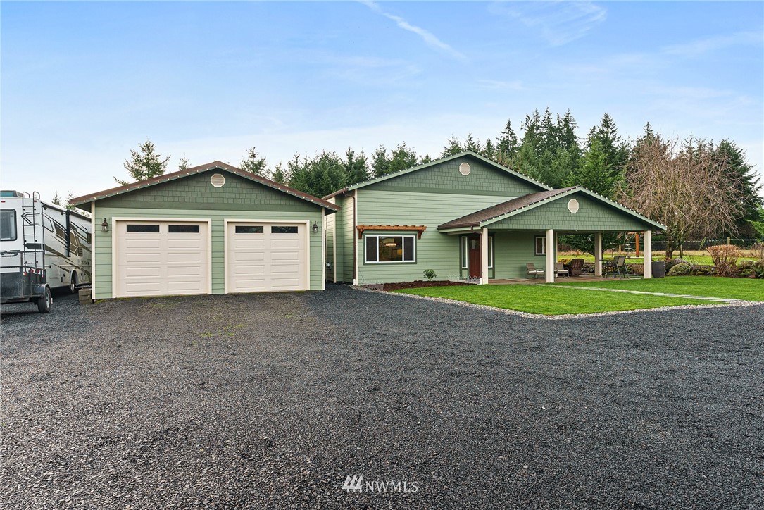 469 Brown Road East Chehalis, WA 98532 - Photo 1 of 35 a white house with a small yard and wooden fence