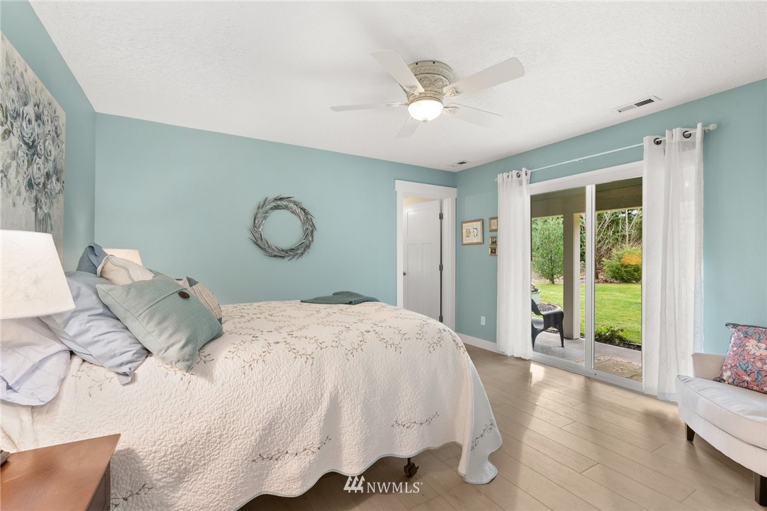 469 Brown Road East Chehalis, WA 98532 - Photo 15 of 35 a bed sitting in a spacious bedroom next to a window