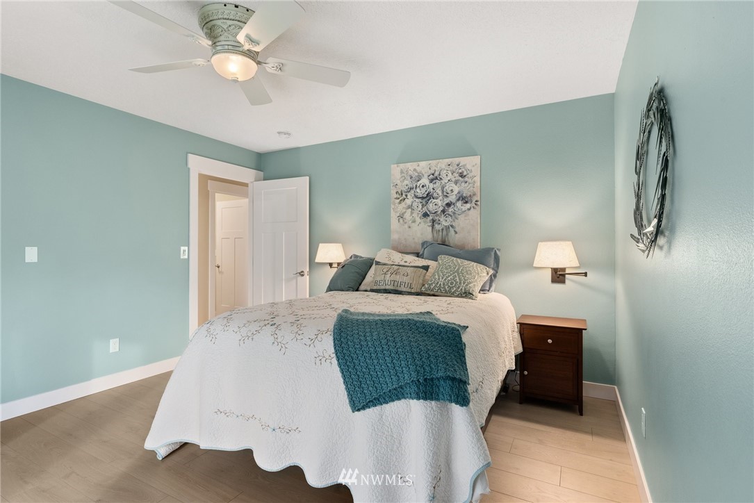 469 Brown Road East Chehalis, WA 98532 - Photo 16 of 35 a bedroom with a bed and a chandelier