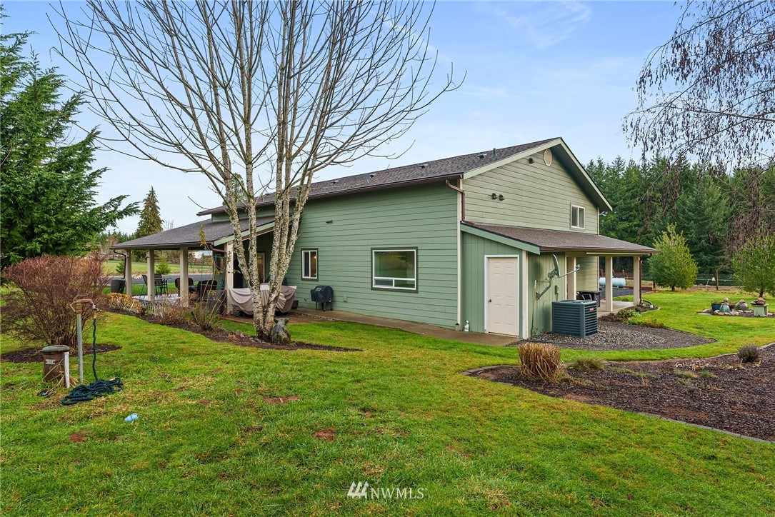 469 Brown Road East Chehalis, WA 98532 - Photo 30 of 35 a view of a house with a yard and sitting area