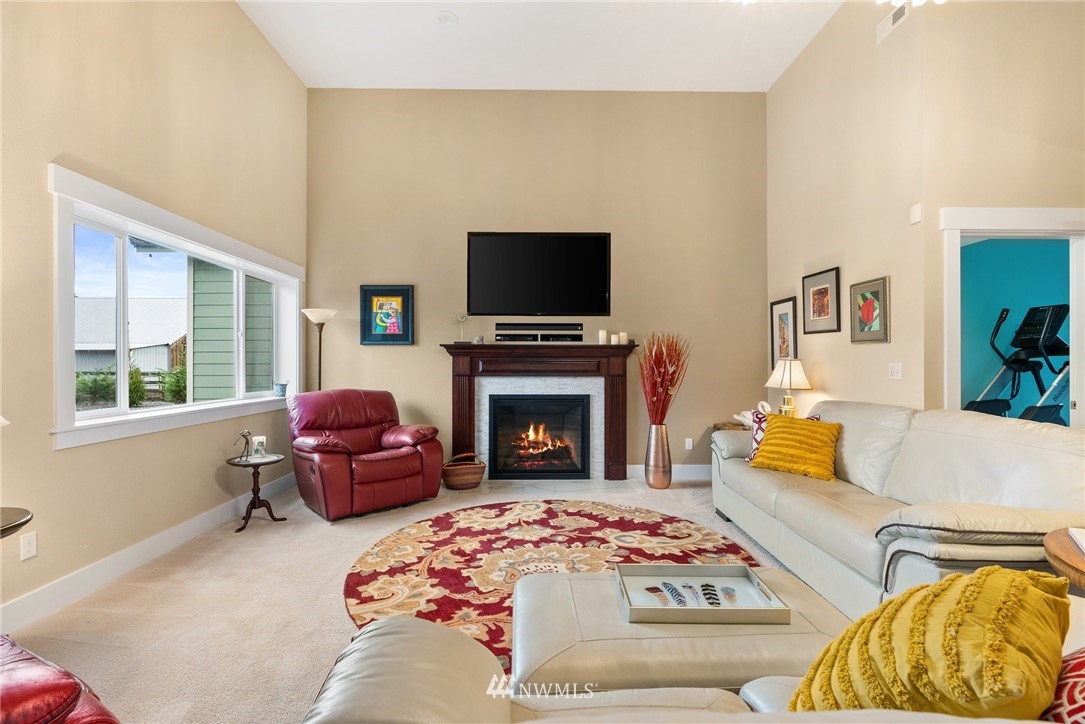 469 Brown Road East Chehalis, WA 98532 - Photo 7 of 35 a living room with furniture a flat screen tv and a fireplace