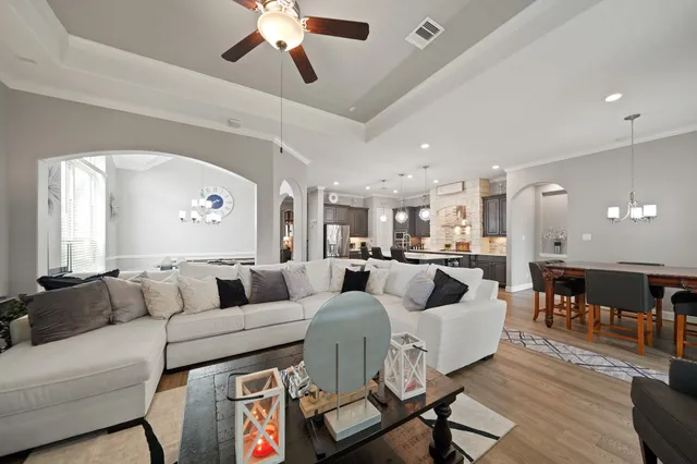 a bed room with a bed and a chandelier