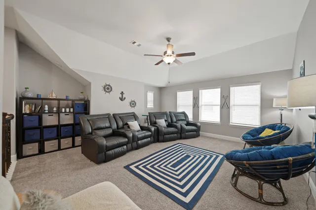 a view of a house with backyard porch and sitting area